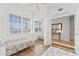 Bright, airy bedroom with hardwood floors and a mirrored closet at 7509 Mourning Dove Cir # 303, Reunion, FL 34747