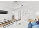 Neutral bedroom showcasing an entertainment center and views into dining room at 7509 Mourning Dove Cir # 303, Reunion, FL 34747