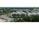 Exterior view of a residential building with balconies, landscaping, and street view at 7509 Mourning Dove Cir # 303, Reunion, FL 34747