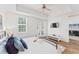Large main bedroom with wood floors and access to an outdoor living area at 7509 Mourning Dove Cir # 303, Reunion, FL 34747
