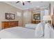Bedroom featuring two twin beds, neutral walls, carpeted floor, and TV at 7550 Gathering Dr, Reunion, FL 34747
