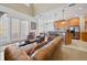 Open-concept living space seamlessly connects the living room to the kitchen and dining area at 7550 Gathering Dr, Reunion, FL 34747