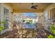 Outdoor patio featuring brick pavers, ceiling fan, stainless steel grill, and pool views at 7550 Gathering Dr, Reunion, FL 34747