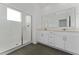 Modern bathroom featuring a glass-enclosed shower and a double sink vanity with ample counter space at 7728 Stone Creek Trl, Kissimmee, FL 34747