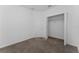 Bedroom featuring neutral carpet flooring and a closet with ample storage space at 7728 Stone Creek Trl, Kissimmee, FL 34747