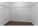 Spacious walk-in closet with wire shelving for optimal storage and organization at 7728 Stone Creek Trl, Kissimmee, FL 34747