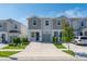Charming townhome featuring a well-manicured lawn, driveway, and attached one car garage at 7728 Stone Creek Trl, Kissimmee, FL 34747
