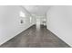Spacious living room featuring gray tile flooring and lots of natural light at 7728 Stone Creek Trl, Kissimmee, FL 34747