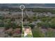 An aerial shot of the home with proximity to a large body of water and industrial area at 906 Elm Forest Dr, Minneola, FL 34715