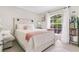 Charming bedroom with a large window, cozy decor, and ample natural light at 906 Elm Forest Dr, Minneola, FL 34715