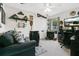 Eclectic bedroom with sofa, TV, and varied decor, showcasing a personalized space at 906 Elm Forest Dr, Minneola, FL 34715