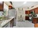Well-equipped kitchen with stainless steel appliances, granite countertops, and ample cabinet space at 906 Elm Forest Dr, Minneola, FL 34715