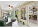 Bright sunroom filled with plants and cozy seating, perfect for relaxation and enjoying natural light at 906 Elm Forest Dr, Minneola, FL 34715
