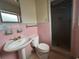 Bathroom with step in shower and pink tiling at 930 Aultman Rd, Kissimmee, FL 34744