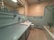 Bathroom with ample counter space and blue tiling at 930 Aultman Rd, Kissimmee, FL 34744