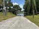 Private boat ramp leading to tranquil waters, surrounded by lush greenery and wooden docks at 930 Aultman Rd, Kissimmee, FL 34744