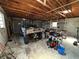 Large garage with utility vehicle, wooden rafters, and overhead lighting at 930 Aultman Rd, Kissimmee, FL 34744