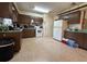 Spacious kitchen with white appliances, lots of wooden cabinets and ample counter space at 930 Aultman Rd, Kissimmee, FL 34744