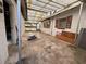 Covered patio featuring a clear roof and brick accent wall at 930 Aultman Rd, Kissimmee, FL 34744