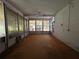 Spacious screened porch with an open view of the backyard and a ceiling fan at 930 Aultman Rd, Kissimmee, FL 34744