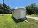 Exterior view of a backyard shed with access ramp and green lawn at 930 Aultman Rd, Kissimmee, FL 34744