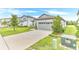 Lovely single-story home with a well-maintained lawn and a spacious driveway leading to the garage at 983 Silverlake Blvd, Lake Alfred, FL 33850