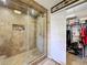 The bathroom features a large glass shower with tile and a closet nearby at 1011 Dampierre Ct, Kissimmee, FL 34759