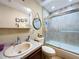 Bathroom with shower and neutral-colored walls at 1011 Dampierre Ct, Kissimmee, FL 34759