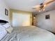 Bedroom featuring a ceiling fan, neutral walls, and closet space at 1011 Dampierre Ct, Kissimmee, FL 34759