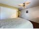 Bedroom with a ceiling fan and closet in a neutral color palette at 1011 Dampierre Ct, Kissimmee, FL 34759