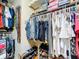 Walk-in closet featuring custom shelving and hanging storage at 1011 Dampierre Ct, Kissimmee, FL 34759