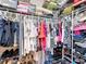 Walk-in closet with clothing, shoes, and stacked storage at 1011 Dampierre Ct, Kissimmee, FL 34759