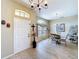 Inviting dining area with a chandelier, stylish table setting, and natural light at 1011 Dampierre Ct, Kissimmee, FL 34759