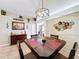 Cozy dining area featuring decorative accents, modern lighting, and a stylish dark wood table at 1011 Dampierre Ct, Kissimmee, FL 34759