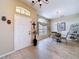 Elegant entryway with neutral tile flooring, a decorative front door, and arched transom window at 1011 Dampierre Ct, Kissimmee, FL 34759