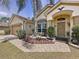 Stunning home with beautiful landscaping, decorative walkway, and welcoming entrance at 1011 Dampierre Ct, Kissimmee, FL 34759