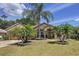 Charming single-story home with lush landscaping and a well-maintained lawn at 1011 Dampierre Ct, Kissimmee, FL 34759
