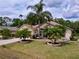 Beautiful home with manicured lawn, tropical landscaping, and charming curb appeal at 1011 Dampierre Ct, Kissimmee, FL 34759