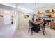 Eat-in kitchen with wood cabinets and stainless steel appliances, open to the dining area at 1011 Dampierre Ct, Kissimmee, FL 34759
