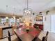 Bright, open kitchen with stainless steel appliances, granite countertops, and connected dining area at 1011 Dampierre Ct, Kissimmee, FL 34759