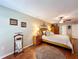 Spacious main bedroom with a ceiling fan, wood furnishings, and a private entry to the bathroom at 1011 Dampierre Ct, Kissimmee, FL 34759