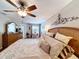 Comfortable main bedroom with wood floors, ceiling fan, and a private vanity at 1011 Dampierre Ct, Kissimmee, FL 34759