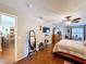 Spacious main bedroom boasts a ceiling fan, television, and a view to the outdoor area at 1011 Dampierre Ct, Kissimmee, FL 34759