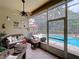 Relax on the screened-in lanai with comfortable seating and views of the pool and backyard at 1011 Dampierre Ct, Kissimmee, FL 34759
