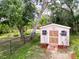 Backyard storage shed with lush green surroundings at 1011 Dampierre Ct, Kissimmee, FL 34759