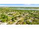Lush greenery meets a tranquil lake in this desirable neighborhood at 1024 Cohassett Ave, Lake Wales, FL 33853