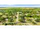 Property with location pin is shown in aerial photo, highlighting the neighborhood's layout and green surroundings at 1024 Cohassett Ave, Lake Wales, FL 33853