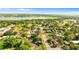 Wide aerial shot of residential area highlighting the proximity to a lake and the community's layout at 1024 Cohassett Ave, Lake Wales, FL 33853