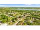 Scenic aerial view of a neighborhood with a lake, showcasing the property's location and nearby natural beauty at 1024 Cohassett Ave, Lake Wales, FL 33853