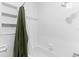 Bright bathroom features a shower and bath with white tile and updated fixtures at 1024 Cohassett Ave, Lake Wales, FL 33853